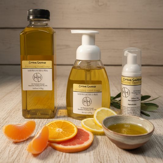 Citrus Sunrise foaming hand soap collection including refill bottle, pump bottle, and travel size with citrus slices