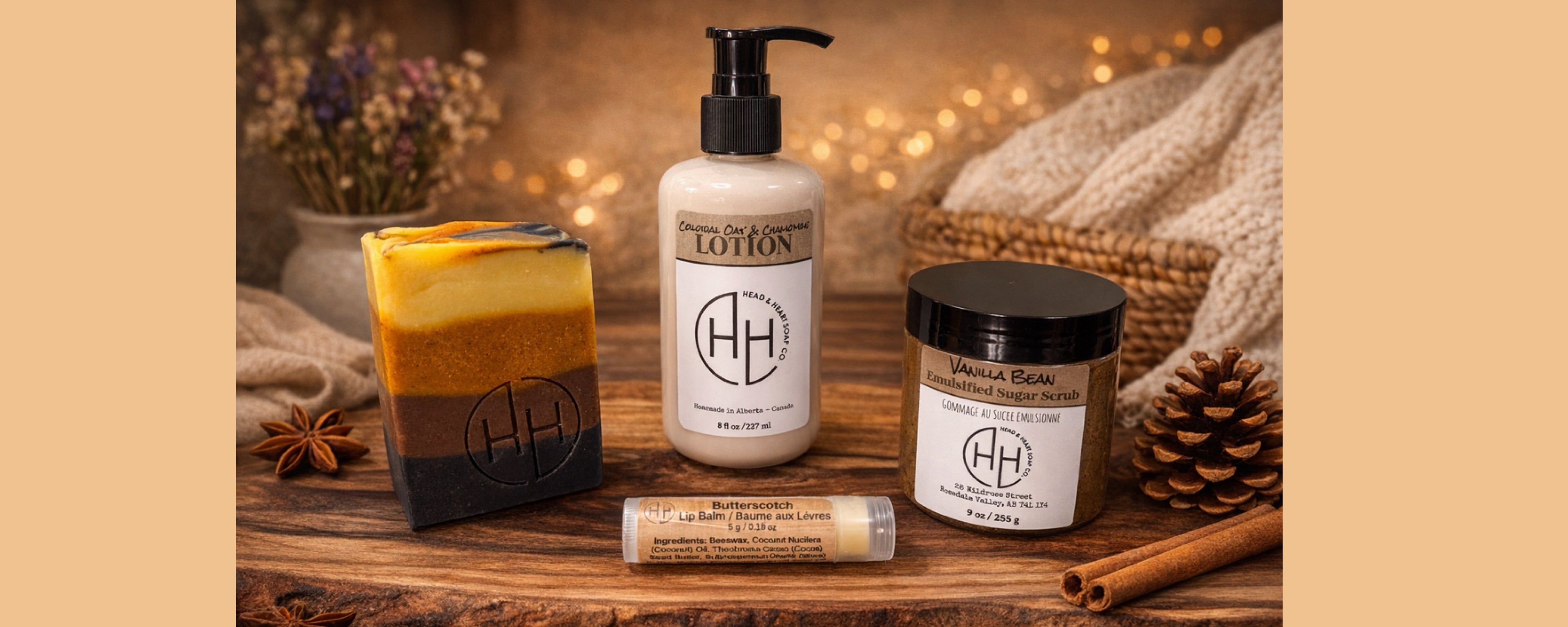 Handcrafted soap, lotion, body scrub, and lip balm displayed on rustic wooden surface